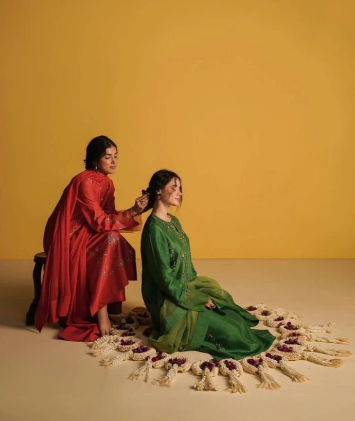 Women wearing elegant ethnic outfits from Vrikaa collection showcasing festive and occasion wear